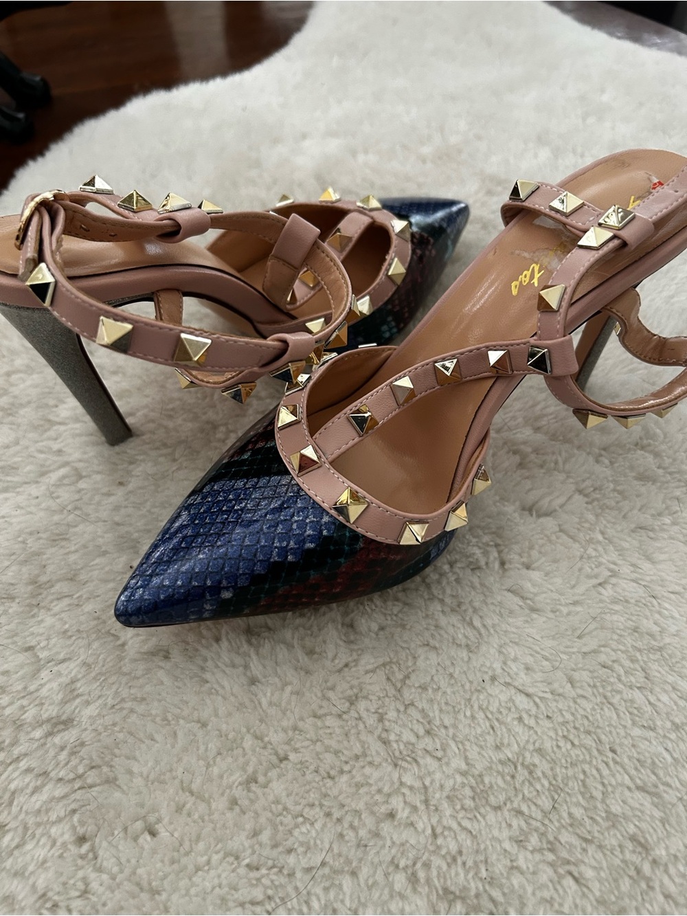 Multi color heels with silver heel and gold accents.